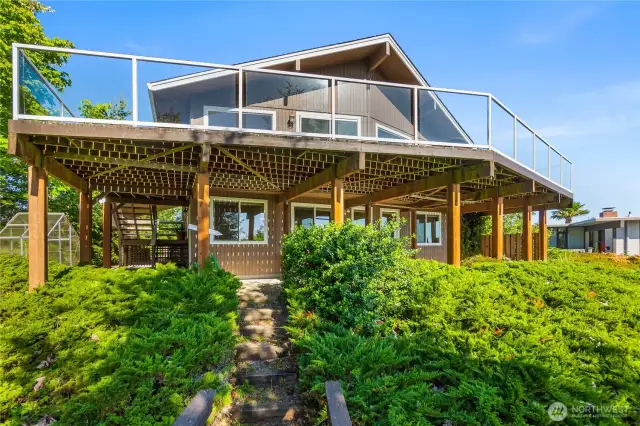 A large deck is the perfect spot to entertain and soak in the amazing vistas this home offers.