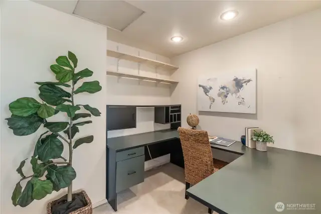 A dedicated office is located near the primary bedroom with a built-in desk surface and shelving.