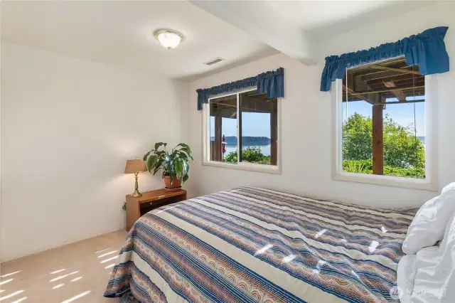 Lower level bedroom with a view of the sound.