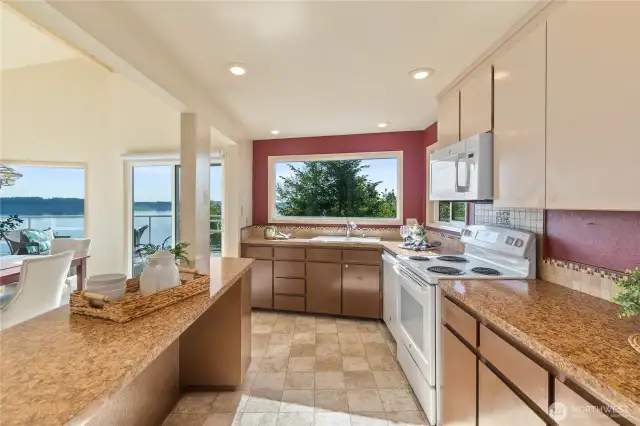 Cooking has never been so pleasant.  Even the kitchen has access to the amazing water and mountain vistas.