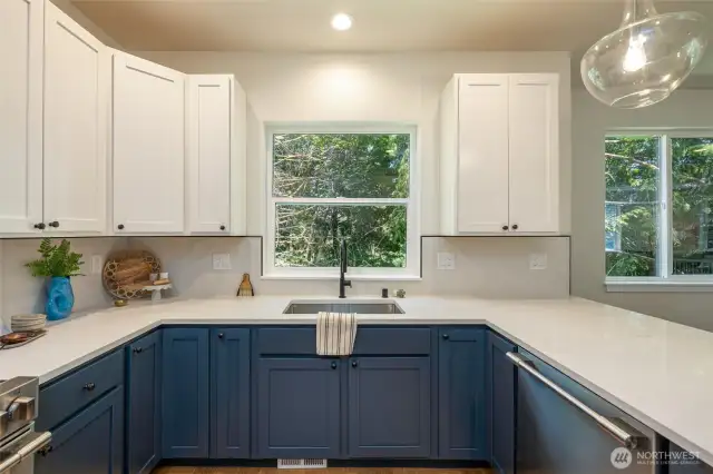 Kitchen with shaker cabinets and quartz countertops