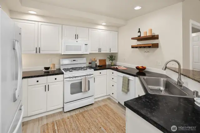 Open living room, dining room, kitchen- opening to private back patio & yard space