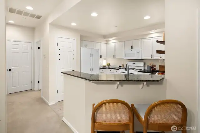 Open living room, dining room, kitchen- opening to private back patio & yard space