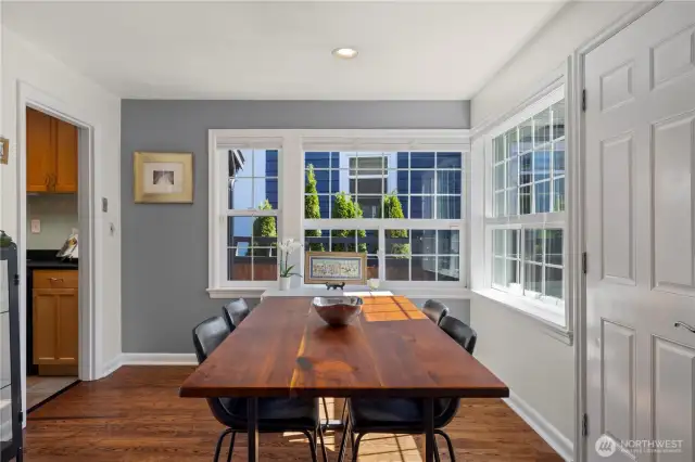 Large corner windows grace the dining room, and that door leads to the front patio which is the perfect spot for your morning coffee.