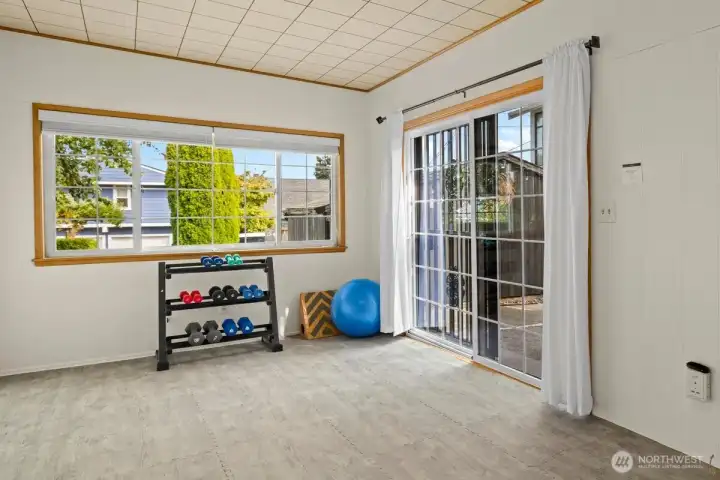This space is staged as a work out room, but could be an additional bedroom. Large sliding glass door leads to the private back patio which provides easy access to the two car garage and side yard.