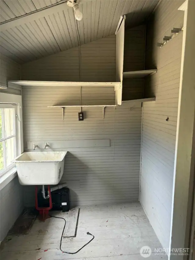 Utility room is located off the back of the kitchen.