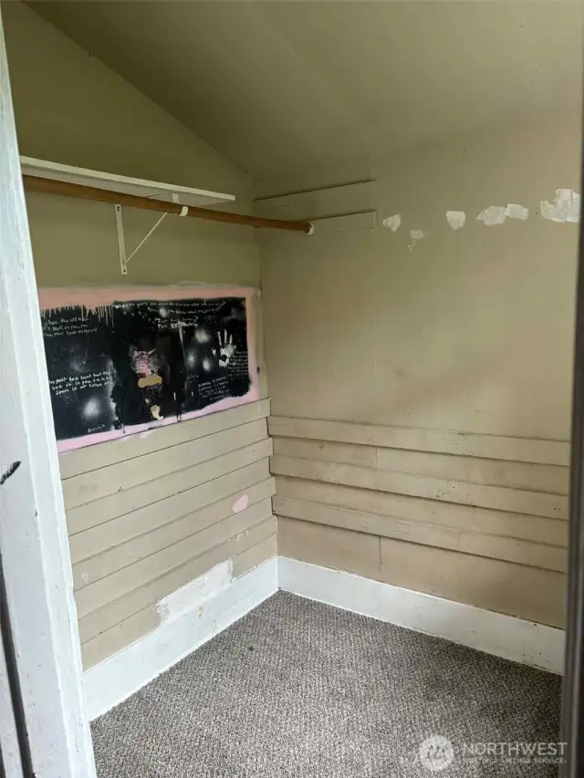 Picture of the walk-in-closet in the second downstairs bedroom at the back of the house.