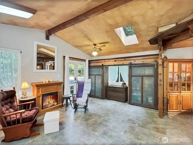 Step through French doors into a spacious, light-filled open layout.