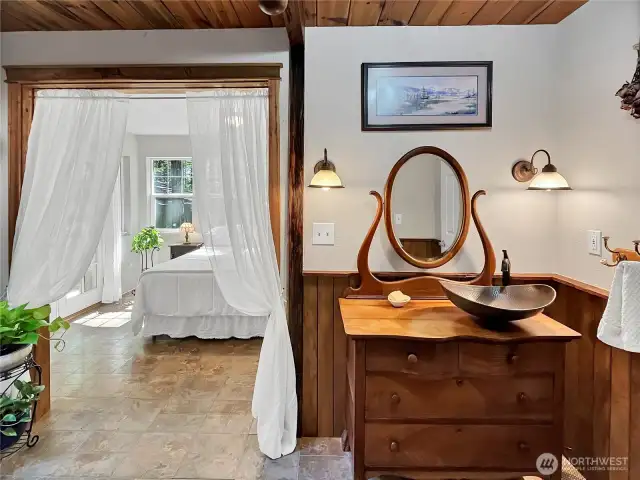 Stylish Hollywood bathroom with separate vanity and bath areas for privacy & convenience.