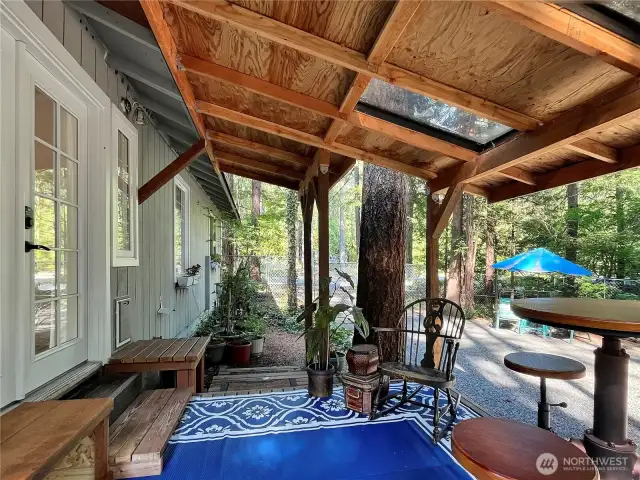 Bedroom opens to a charming deck, perfect for morning coffee or evening relaxation.