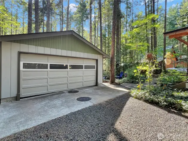Spacious two-car garage with plenty of room for vehicles & storage.