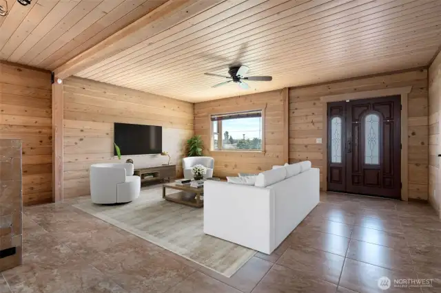 Entry with radiant tile flooring, cozy cedar ceilings & walls plus solar power on the roof to keep electricity bills near zero. Great Room - Entry, Living, Dining & Kitchen - Cozy Gas Fireplace, Cedar interior & Radiant Tile Floors! Virtually staged to show the possibilities!