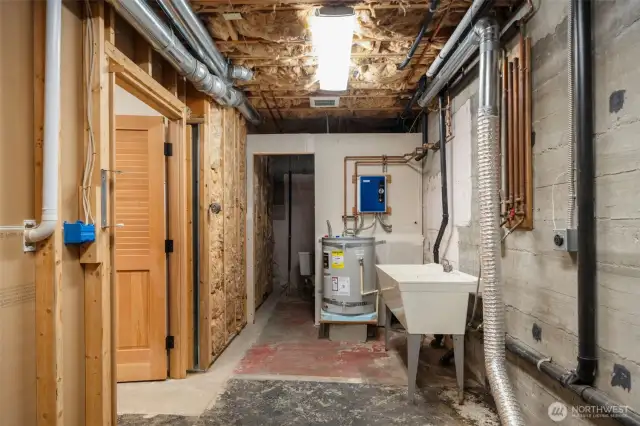 Basement includes original homes floors (to some degree), framework of original bathroom, laundry sink, washer & dryer hookups, newer hot water heater, copper plumbing and more. See home inspection for all the details.