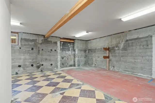 Part of the original home's flooring & foundation - this space off the garage has a lot of potential!