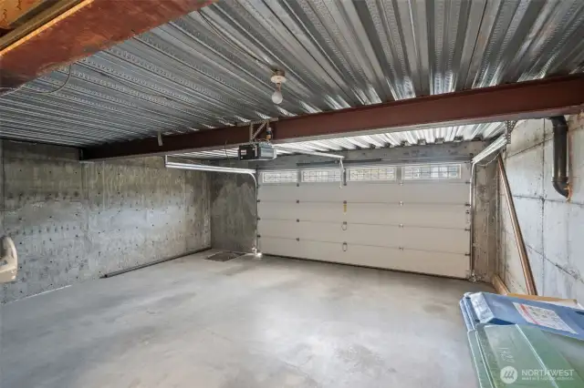 Nice sized (grandfathered in) 2 car garage with great structure for large patio above. Rare to have a 2 car garage just steps to Green Lake!