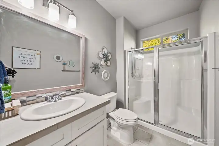 Guest main floor bathroom with a shower