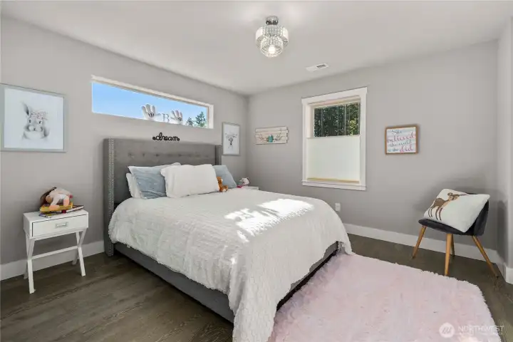 upstairs bedroom with a view of the trees