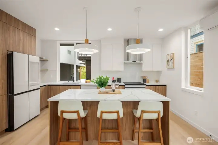 Warm wood tones and sleek white finishes create a perfect balance of modern and cozy.