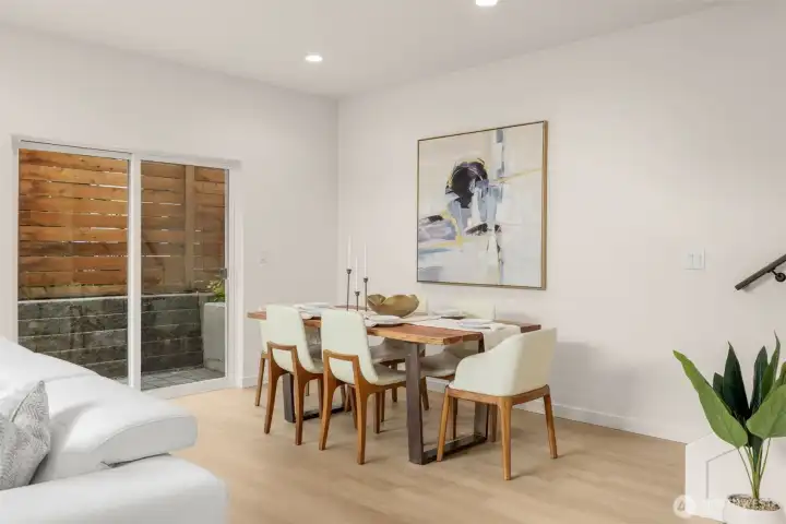 The dining nook glows with natural light—ideal for both casual brunches and candlelit dinners.