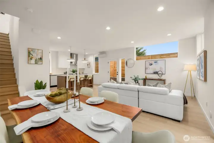 The open layout creates a natural rhythm—move easily from living to dining, from conversation to cooking, always surrounded by light.