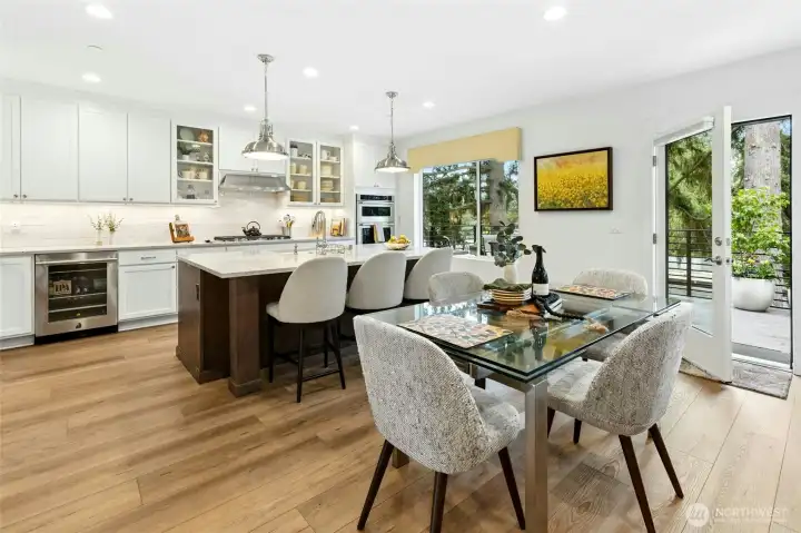 The chef’s kitchen with expansive island flows into a light-filled great room.