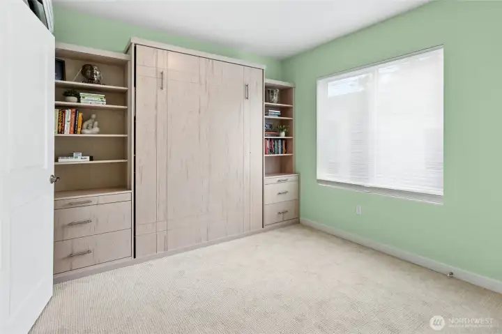 Bedroom #2 with built-in queen Murphy Bed with reading lights.