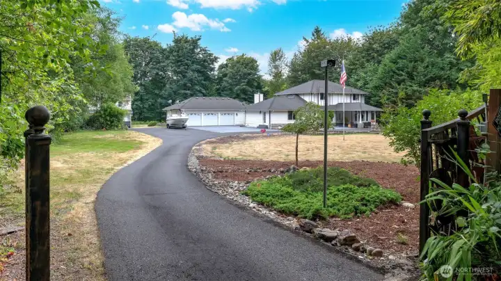 Gated entry welcomes you to 3.79 private acres in Lake Kathleen.