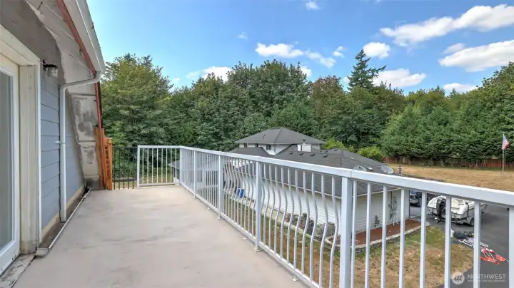 French doors open to a private deck—perfect for morning coffee.