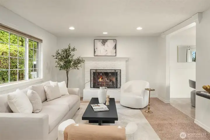 Cozy family room with wood burning fireplace.