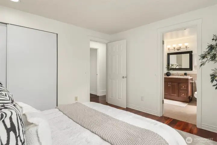 Primary bedroom with entrance into full bathroom
