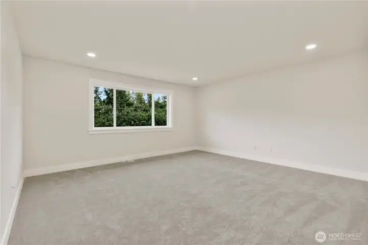 Generous Media/Rec room with additional insulation in interior walls 16' x 16'