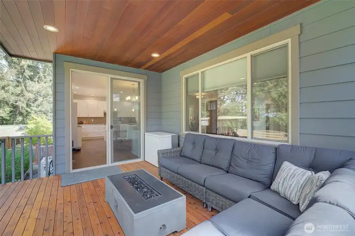 Gorgeous covered deck with beautiful natural wood accents