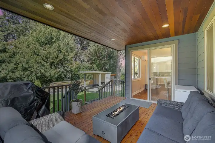 Gorgeous covered deck with beautiful natural wood accents