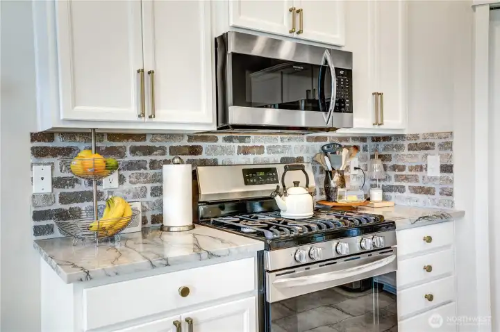5-burner gas stove. Especially in person you'll notice the detail in the countertops, backsplash hardware and general care taken throughout.