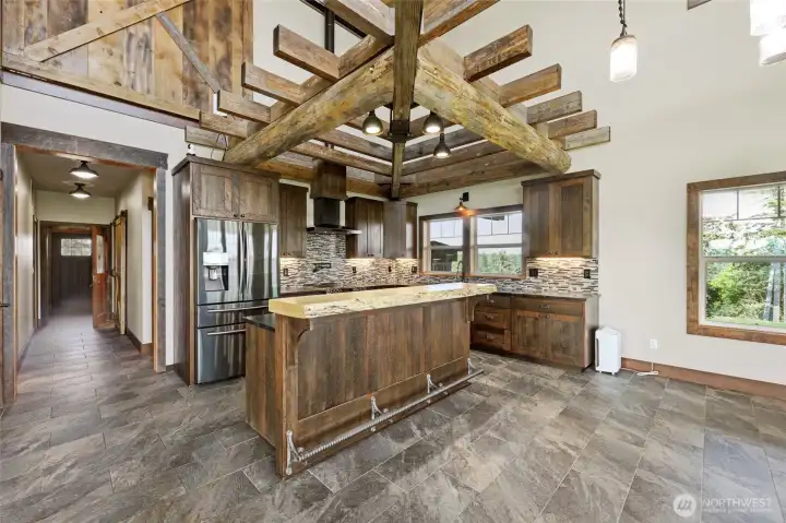 Custom kitchen with soapstone counters & a wooden bar top with a live edge!