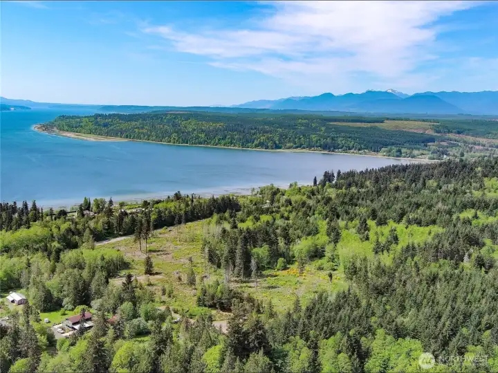 View of the site facing SW into the Olympic Mtn range. Endless recreational opportunities just a few miles away. View of the site facing SW into the Olympic Mtn range. Endless recreational opportunities just a few miles away.