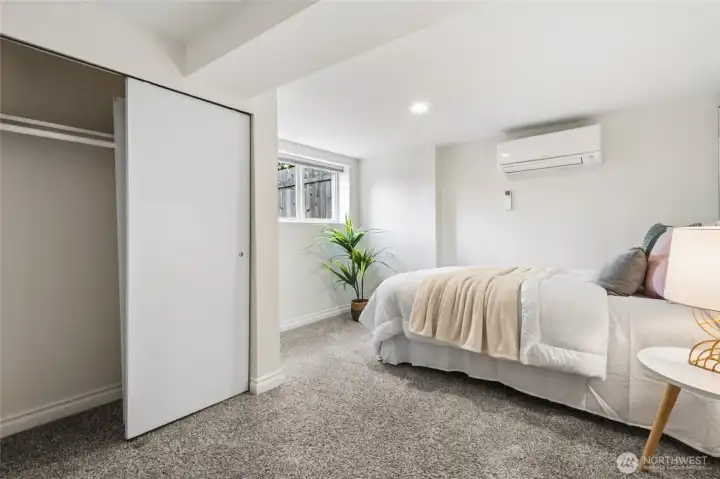 Downstairs bedroom with egress window and closet.