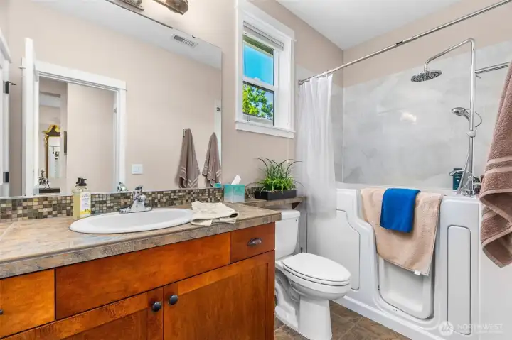 The main bathroom comes complete with an upgraded walk-in bathtub The main bathroom comes complete with an upgraded walk-in bathtub