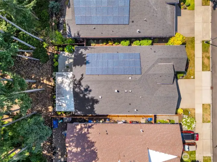 Arial view of th4e top of the home where you can also see the solar panel offering supplemental clean energy for your home Arial view of th4e top of the home where you can also see the solar panel offering supplemental clean energy for your home