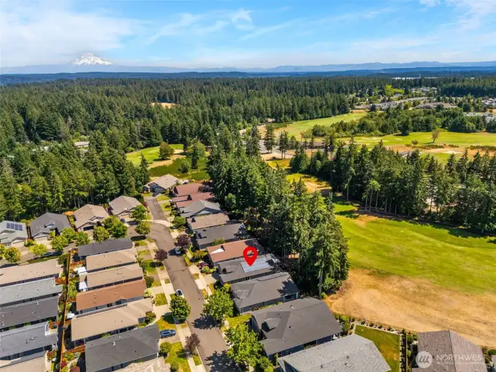 Arial view of the neighborhood and the golf course to the right Arial view of the neighborhood and the golf course to the right