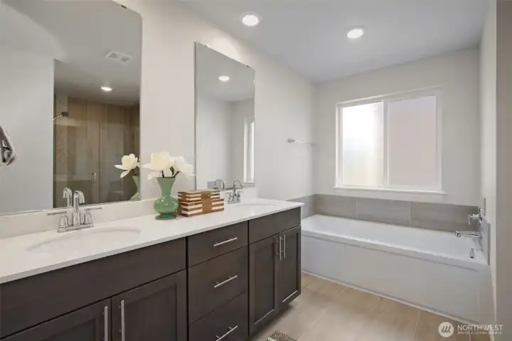 Primary bathroom with quartz counters & double sink. Primary bathroom with quartz counters & double sink.