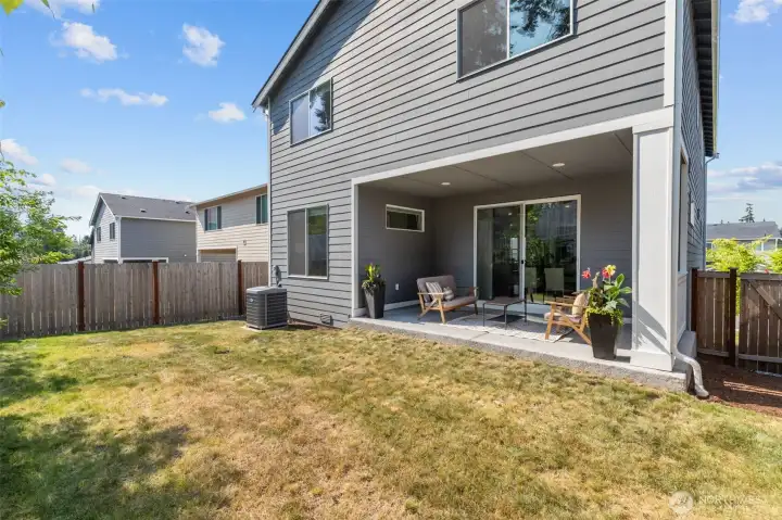 Covered patio offers indoor/outdoor living rain or shine. Covered patio offers indoor/outdoor living rain or shine.