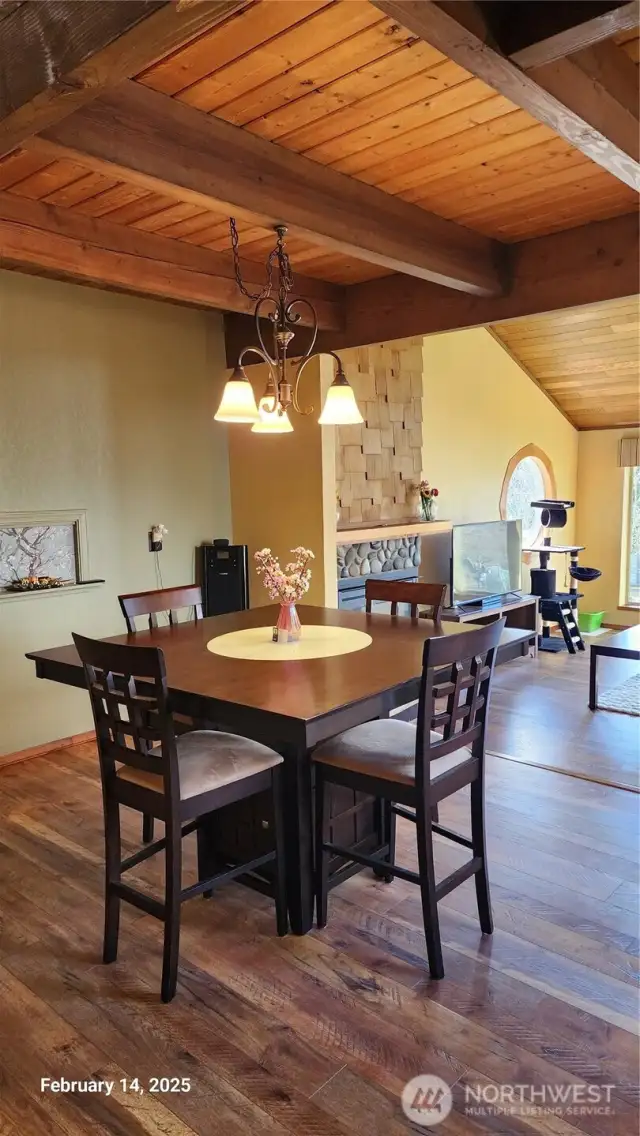 As you walk into the home this beautiful dining room with warm wood finishes and soft lights.