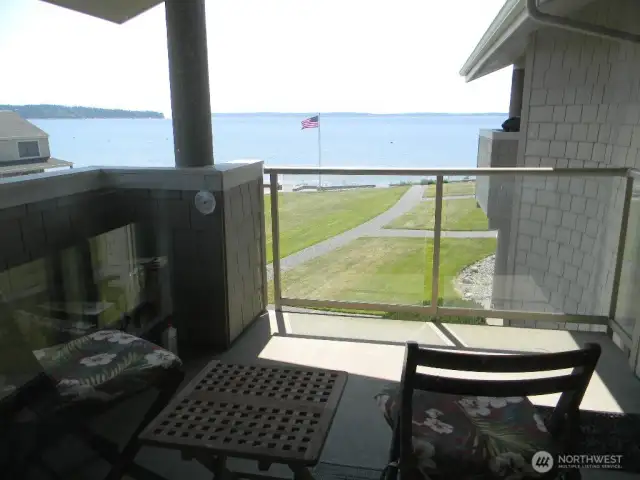 A wonderful covered deck offers unobstructed view of the water.