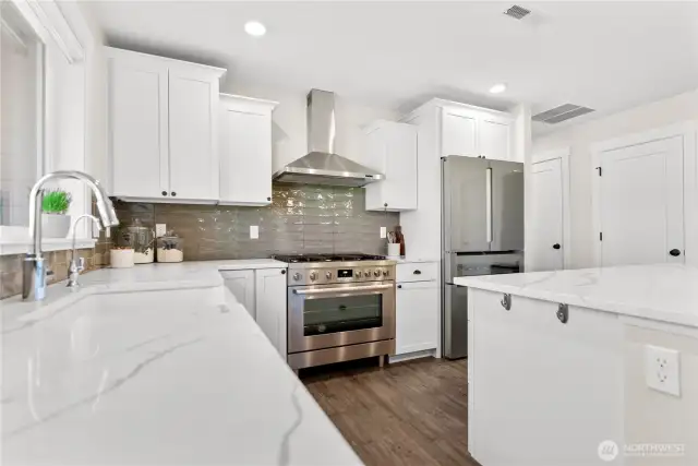 Thoughtfully designed kitchen layout, complete with high-end appliances.