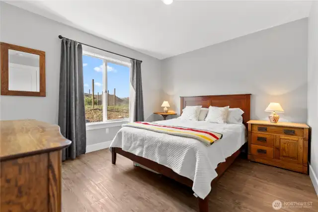 Wake up to spectacular territorial views from this secondary bedroom.