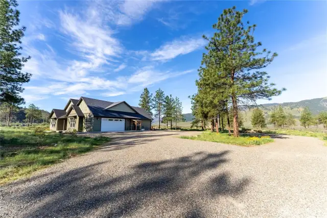 Gravel driveway with plenty of parking and turn-around space.