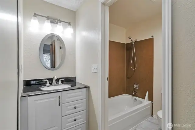 The primary bathroom features all new flooring, toilet and paint!