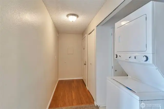 A bright, inviting entry features room for hanging storage, a traditional coat closet and laundry area for convenience!