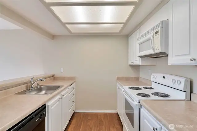 Brand new electric range and newer fridge in this spacious, inviting kitchen!